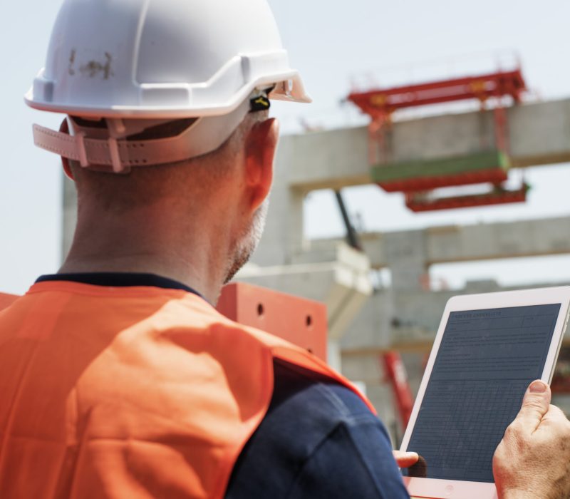 construction-worker-working-outdoors-with-project-scaled.jpg construction-worker-working-outdoors-with-project-scaled.jpg